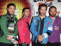 Coldplay помирились с Джо Сатриани