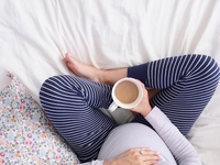 С чем связана ноющая боль у беременной